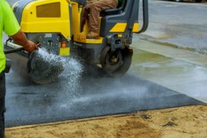 Construction with roller compactor machine and repair asphalt parking for the car